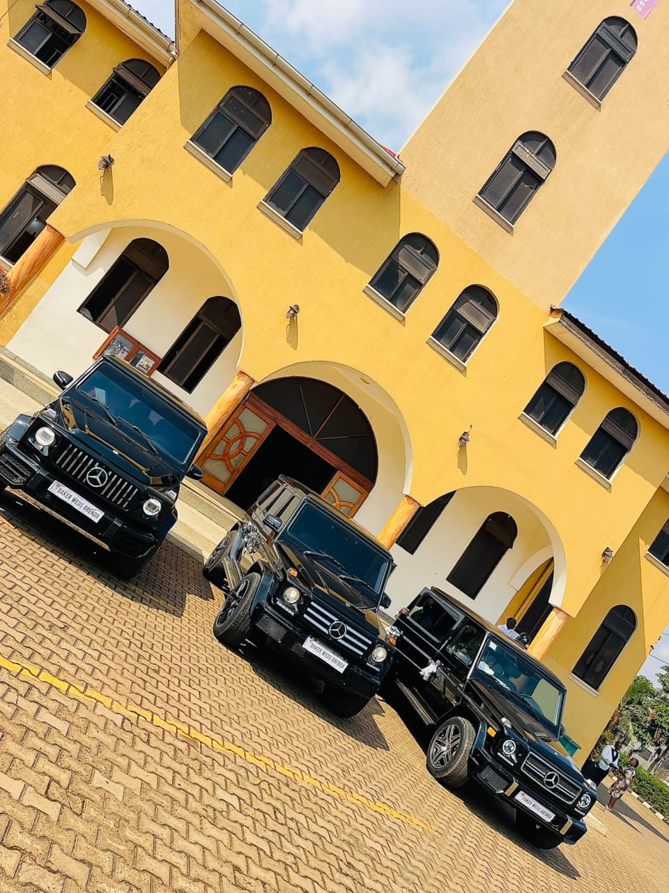 Luxoriax Auto Group fleet of black Mercedes-Benz G-Wagons at a Kampala venue