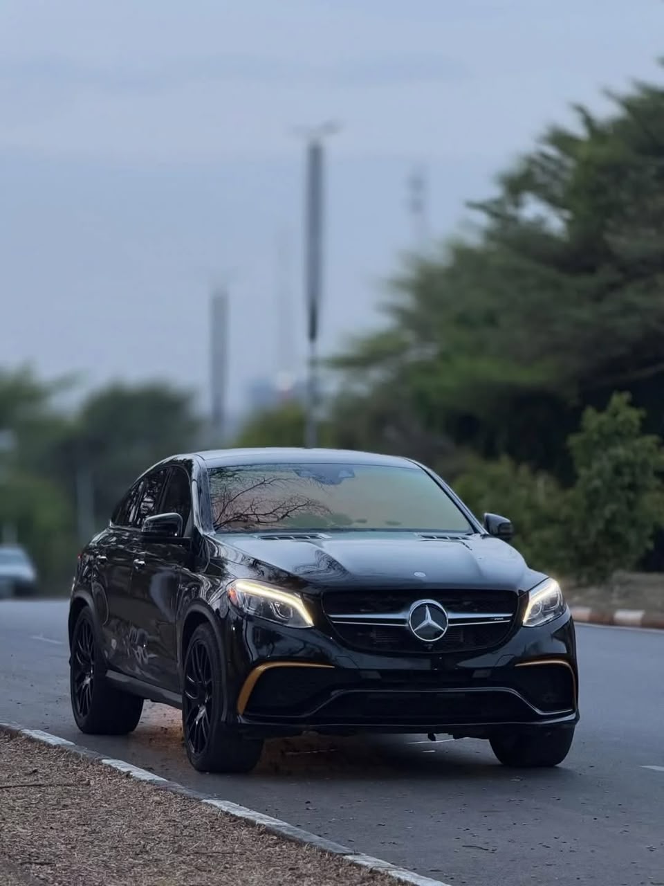 Black Mercedes-Benz GLE Coupe on the move for executive transportation in Kampala, Uganda